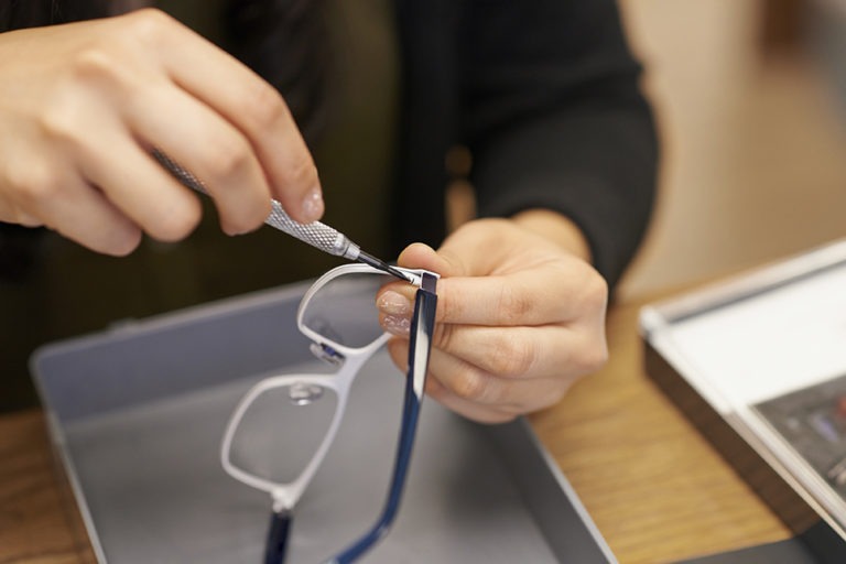 person manufacturing eyeglasses