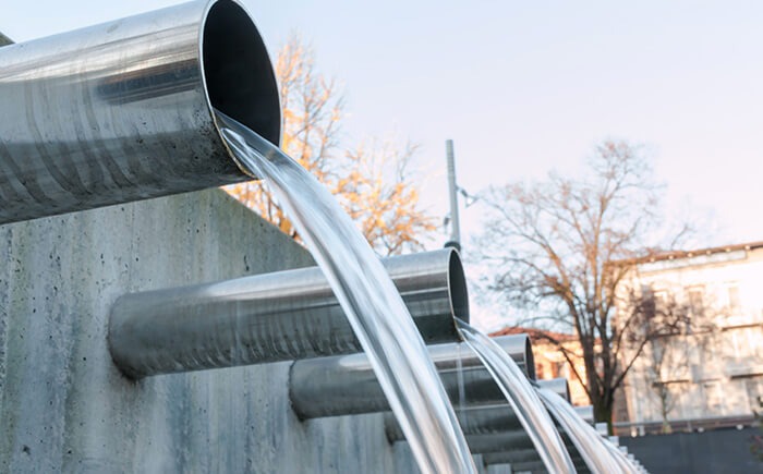 Water flowing from steel pipes