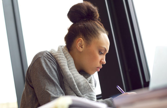 Young woman writing