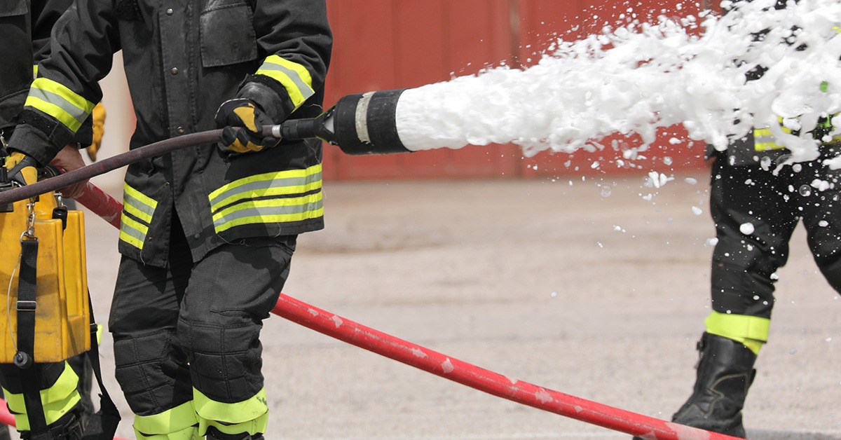 Firefighters using aqueous fire-fighting foam