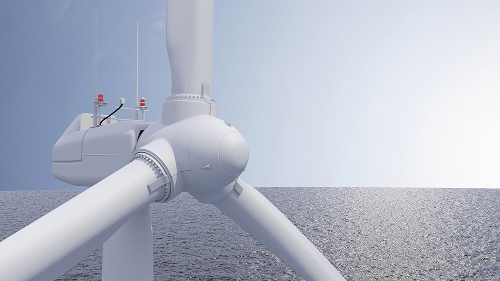 Photo of one offshore wind turbine in ocean.