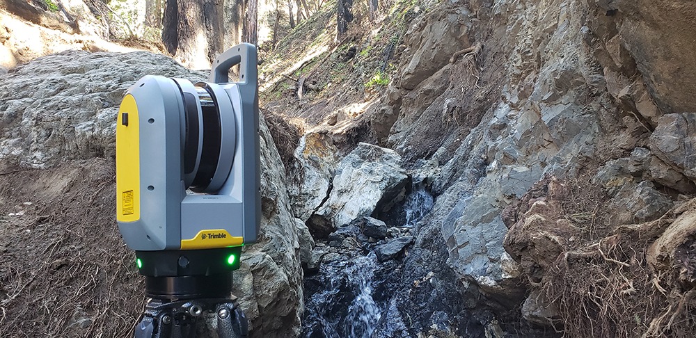 Rat Creek-photo of rocks along hill, creek embankment and equipment.