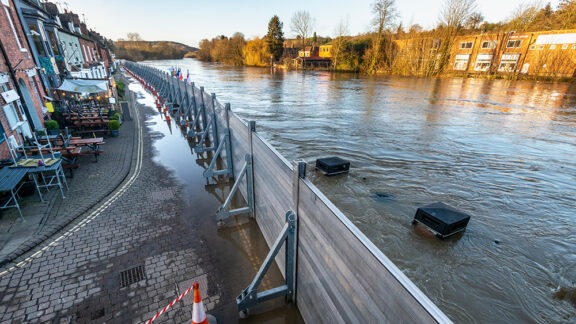 Photo of flood wall protecting town.