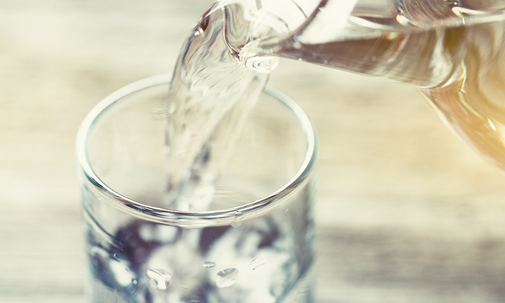 Pouring water into a glass