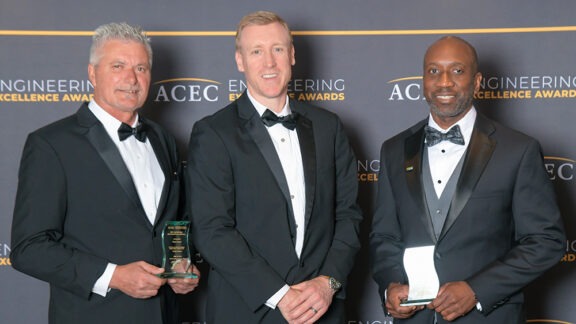 Mauro DeiGiudici, Forrest Paul, and Derrick Shelton hold their awards at the 2025 Engineering Excellence Awards gala.