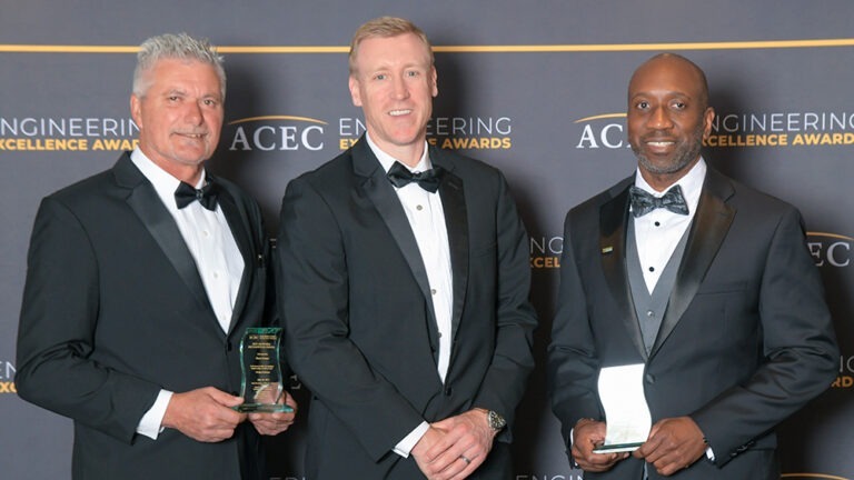 Mauro DeiGiudici, Forrest Paul, and Derrick Shelton hold their awards at the 2025 Engineering Excellence Awards gala.