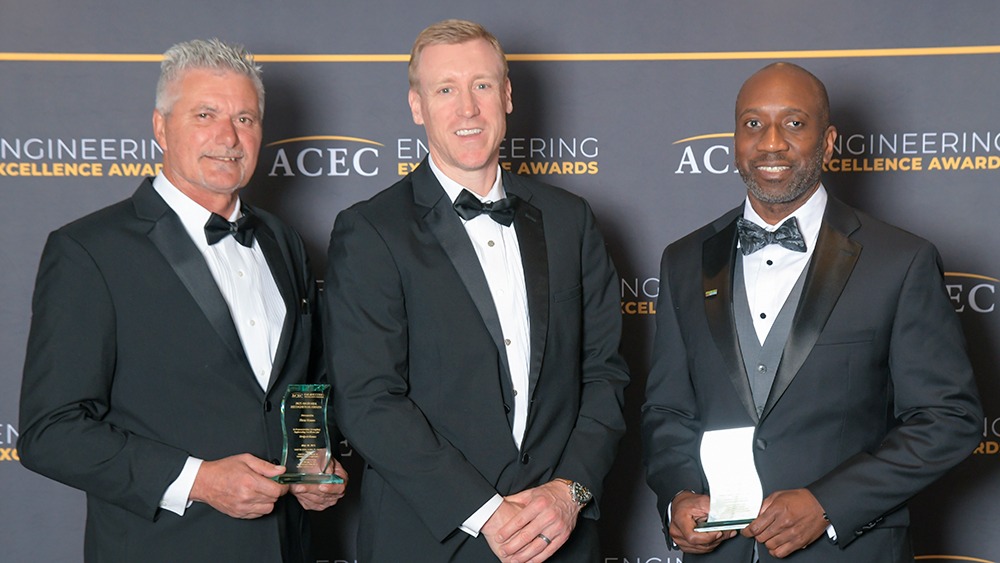 Mauro DeiGiudici, Forrest Paul, and Derrick Shelton hold their awards at the 2025 Engineering Excellence Awards gala.