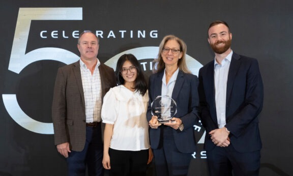Image of award recipients with their trophy at the event.