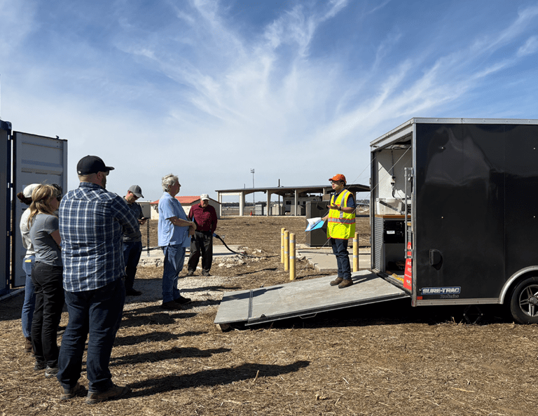 Haley & Aldrich's Raul Tenorio speaking to visitors on an EradiFluor site.