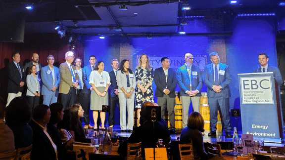 Recipients including Haley & Aldrich’s Ian Phillips (fourth from left) on stage at the Environmental Business Council of New England’s award ceremony