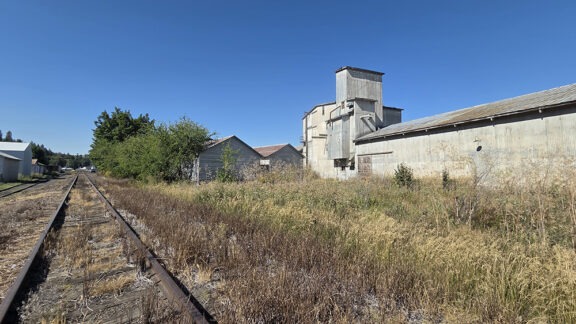 Railroad tracks behind building