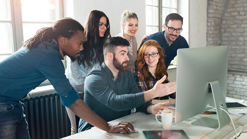 People looking at computer